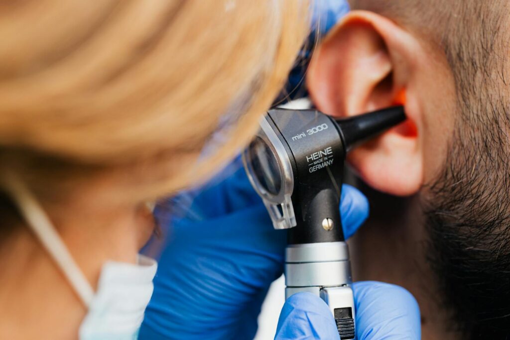 A Doctor Doing Ear Examination